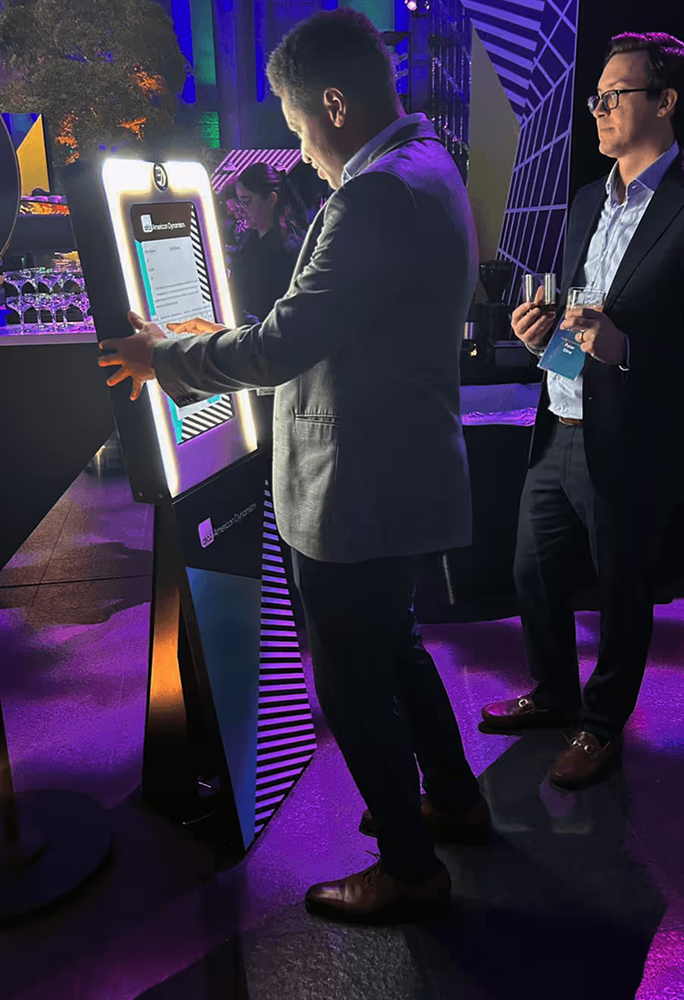 Guests posing at the kiosk booth